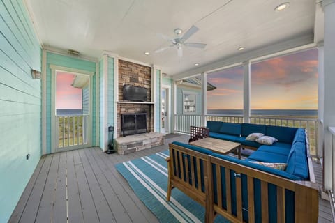 Spacious outdoor living area with wood fireplace