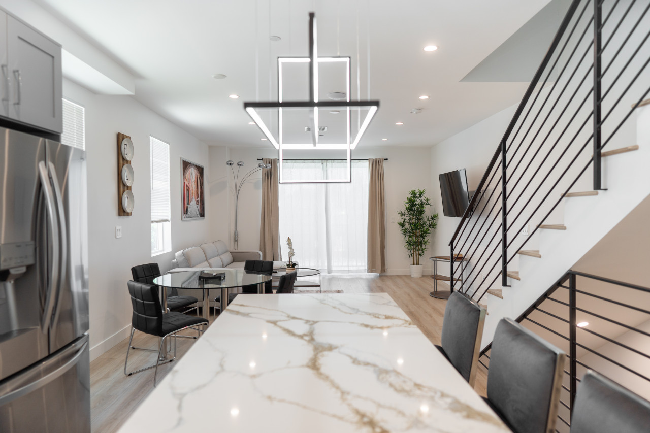 MODERN 3-4 BEDROOM TOWNHOME BUILT IN 2023 WITH OFFICE, BONUS ROOM, 2-CAR GARAGE WITH EV CHARGER & 2 BALCONIES (p63)