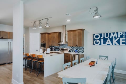 Full kitchen includes island seating for 4, dining seating for 10, double ovens, warming drawer, under counter freezer, microwave, double refrigerators and ice maker.