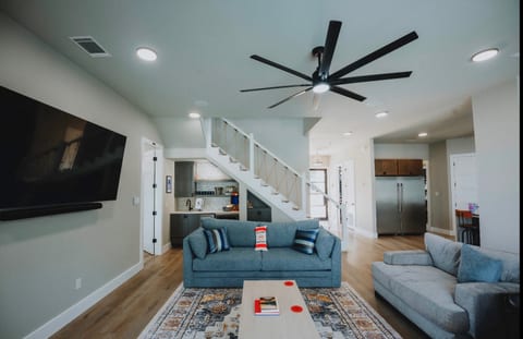 Living room, wet bar and kitchen to the right.