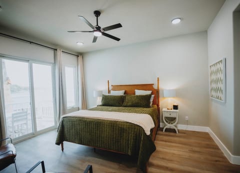 Captain's Quarters includes a king size bed and private doors to patio and pool area.