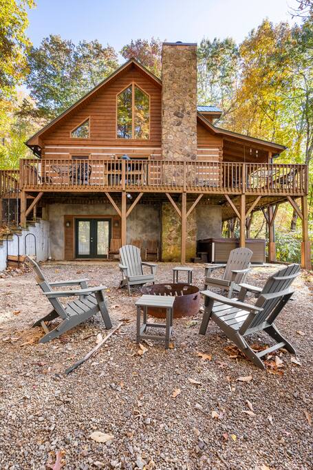 Fire pit area, hot tub and doors to basement - Carolina Moon Cabin in Franklin NC - Franklin