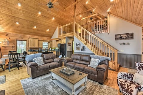 Family room with loft above and kitchen in back ground
