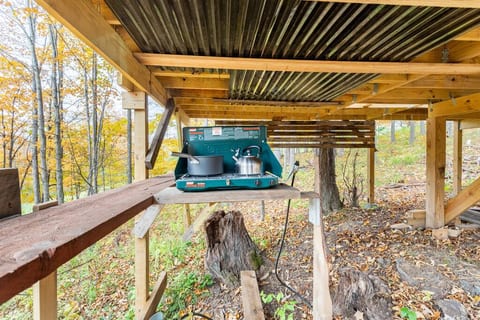 Cooking and hang out area under the deck.  Stays dry and provides shade.  Coleman mini propane stove.
