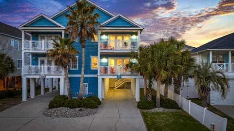 Front of the home, painted a vibrant beach blue.