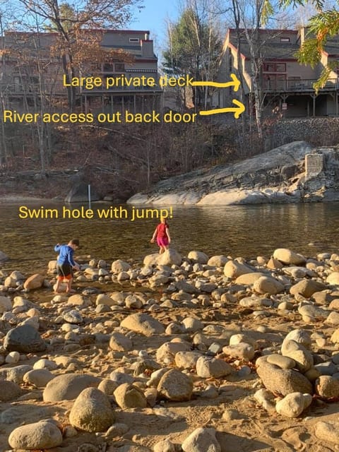 This picture is taken from across the river and over the swim hole to show our home. The river is shallow enough in parts to walk over and deep enough to jump off of the jump. To the left and almost out of view is the little beach area that makes it easy to get in and out, but sliding down and jumping off of the rocks is always an option, too!