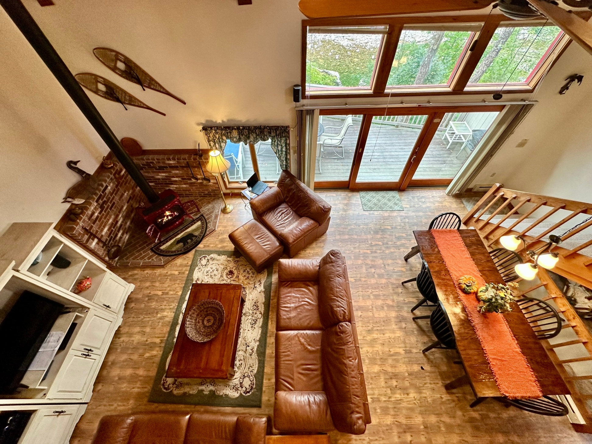 Looking down at the main level great room, deck and river from the top floor.