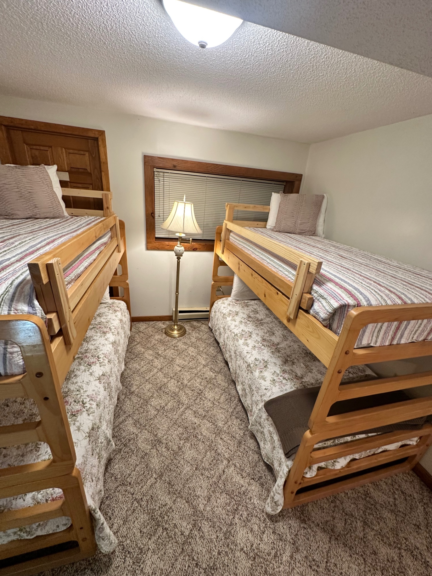 Bunk bed room on lower level. Hardwood and sturdy, the bunk beds sleep adults as well as children. 