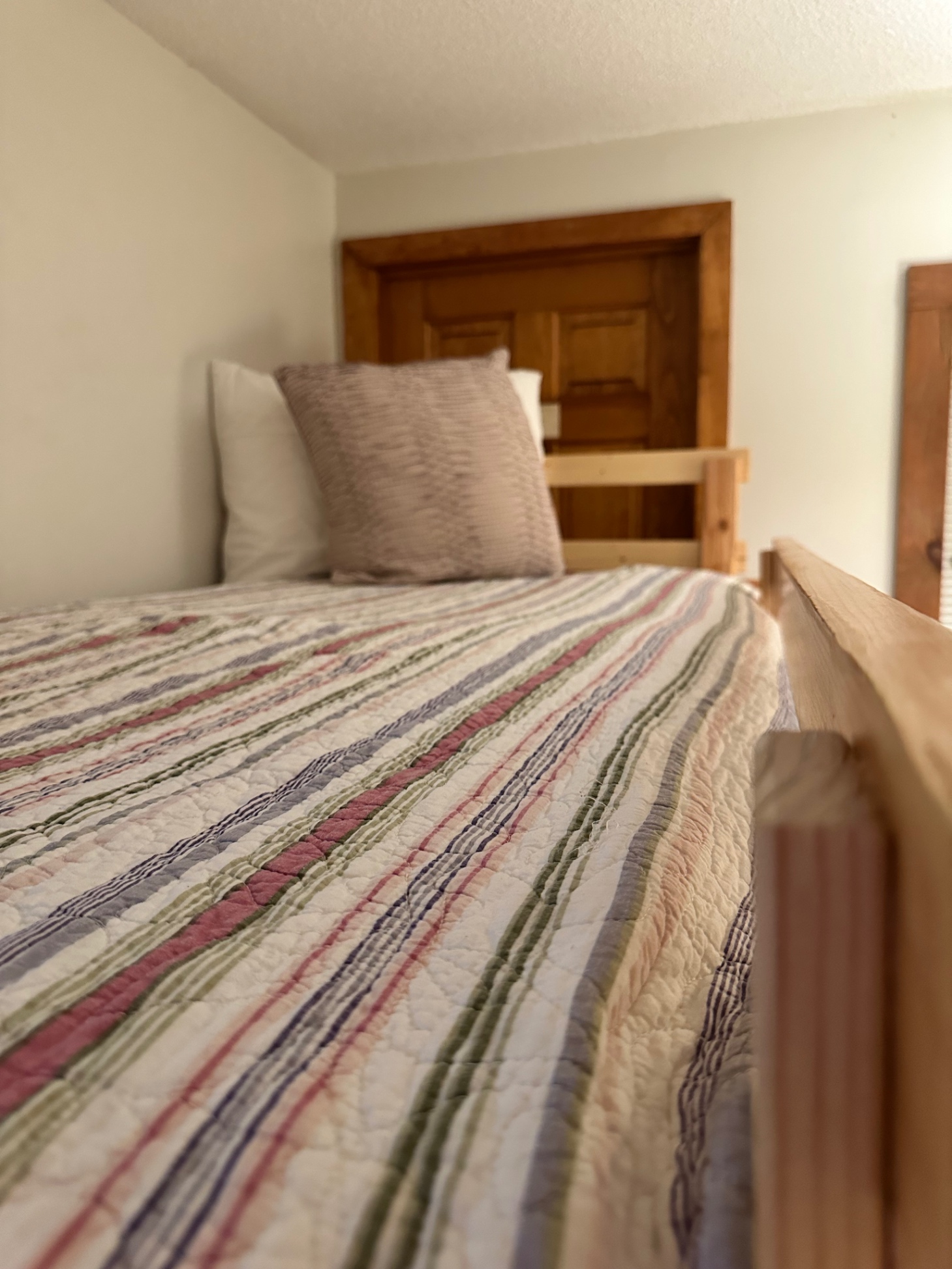 Bunk bed room on lower level. Hardwood and sturdy, the bunk beds sleep adults as well as children. 