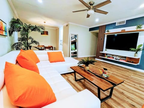 Newly renovated and decorated with modern leather sectional, contemporary entertainment center console with 65" TV.