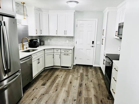 Brand New Kitchen with quartz countertops and all Brand New Stainless Steel appliances. Icemaker and water dispenser in the fridge.