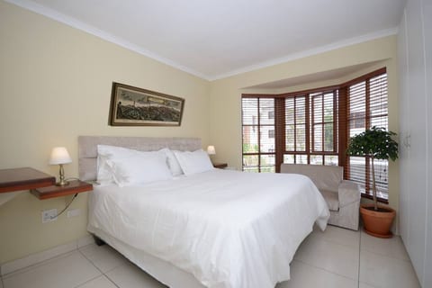 Master Bedroom with extra length king size bed, en suite bathroom comprising bath, shower, double vanity basins, safe in the cupboard, hair dryer.
100% cotton Bed linen with down pillows and duvet.
Egyptian Cotton towels.
Bay window and garden view