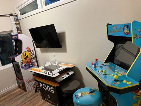 Step into the ultimate game room, featuring classic arcade games, and a cozy seating area. Perfect for family fun or friendly competition, this entertainment hub guarantees hours of excitement and nostalgia for guests of all ages.