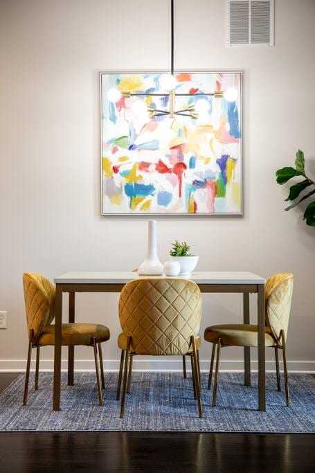 Stylish dining area is a cozy place to enjoy a homemade dinner or enjoy late night drinks and games with friends.