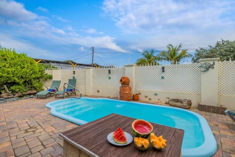 Poolside perfection! Lounge with a refreshing drink or take a dip in the inviting water under the Aruba sun.