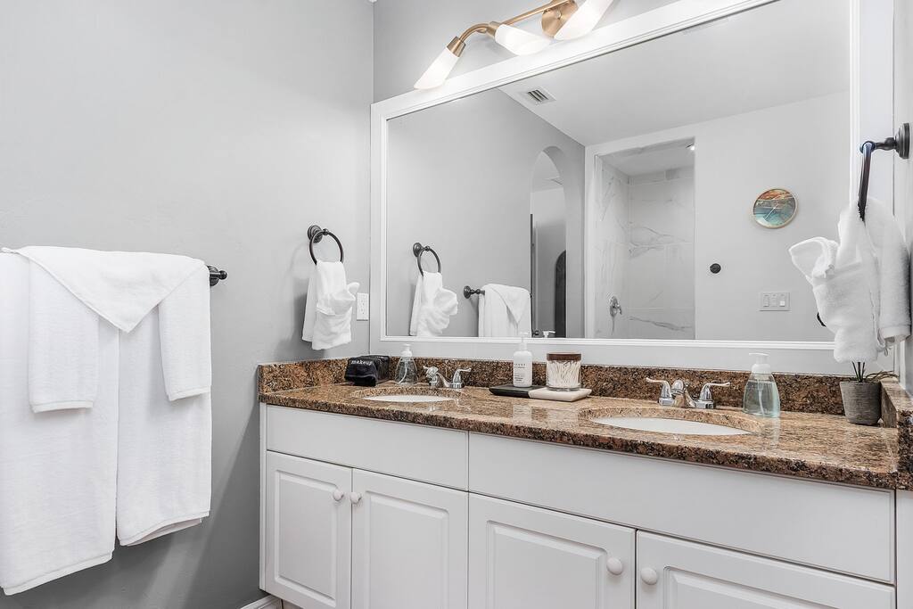 En Suite Bath - Premium Towels, Robes, Walk-In Shower with Multi-Function Shower Head & Detachable/Adjustable Shower Wand & Dimmable Lighting.  Walk-In Closet, Hangers, Luggage Stands.  Water Closet.   Great size for extended stays as well. 