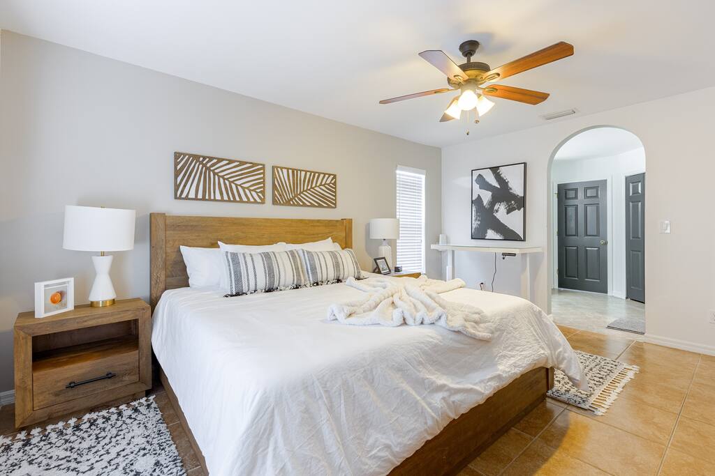 Just beyond the bed as you enter the en suite bath is an adjustable height desk.  Also, provided is an adjustable monitor for your convenience and ultra fast fiber wifi throughout the home.