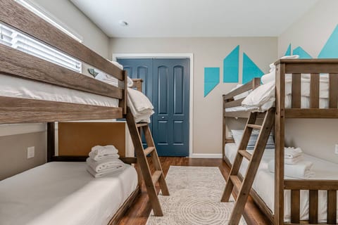Guest Bunkie - (4) twin sized memory foam mattress with premium bedding, duvets/covers.  4 space cubby for personal items.  Dimmable light overhead.  Closet contains extra blankets, hangers, luggage stands, robes etc.