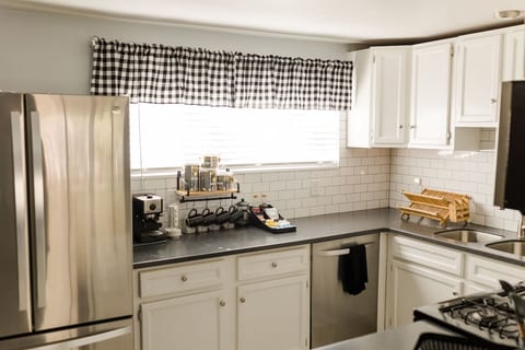 Stocked with cooking essentials; such as pots/pans, silicone utensils, knives, cutting boards, children's and regular dishes, toaster oven....