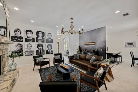 Living Room area with bar, plenty of seating and large smart TV.