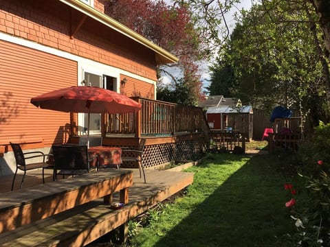 Backyard double deck: coop, flowers and garden with veggies and fruit.