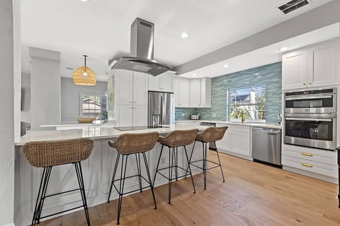 Spacious kitchen featuring two dishwasher, with open layout to formal dining area, breakfast nook and family area.