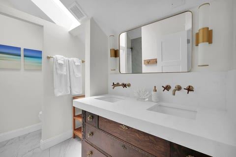 A thoughtfully designed main bath separates the bathing and grooming areas just like a luxury spa. Top of the line Brizo fixtures, Italian tile.