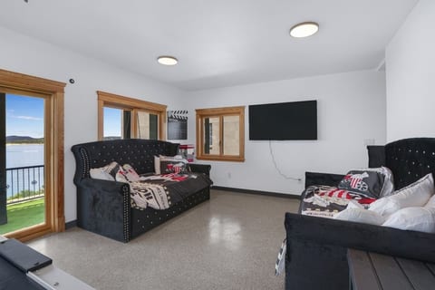 Twin daybeds with trundle pull outs sleep four. Beds also double for seating for a night in at the movies.