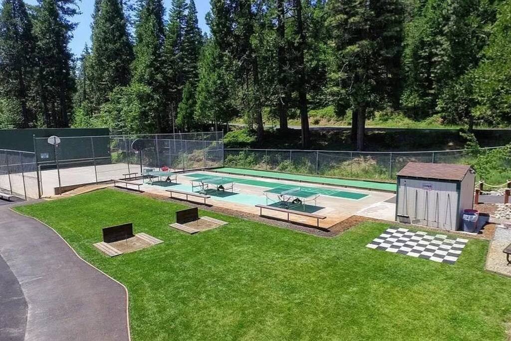 Enjoy sports courts, including tennis, basketball, and volleyball, are available for enjoyment from Memorial Day through Labor Day. Engage in friendly matches and active fun during the sunny months amidst Arnold's scenic mountain landscape. - The Cozy Cub in Blue Lake Springs w/ 2 Lakes & AC - Arnold