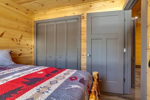 BR 3, upstairs.  Queen Bed, large closet. TV