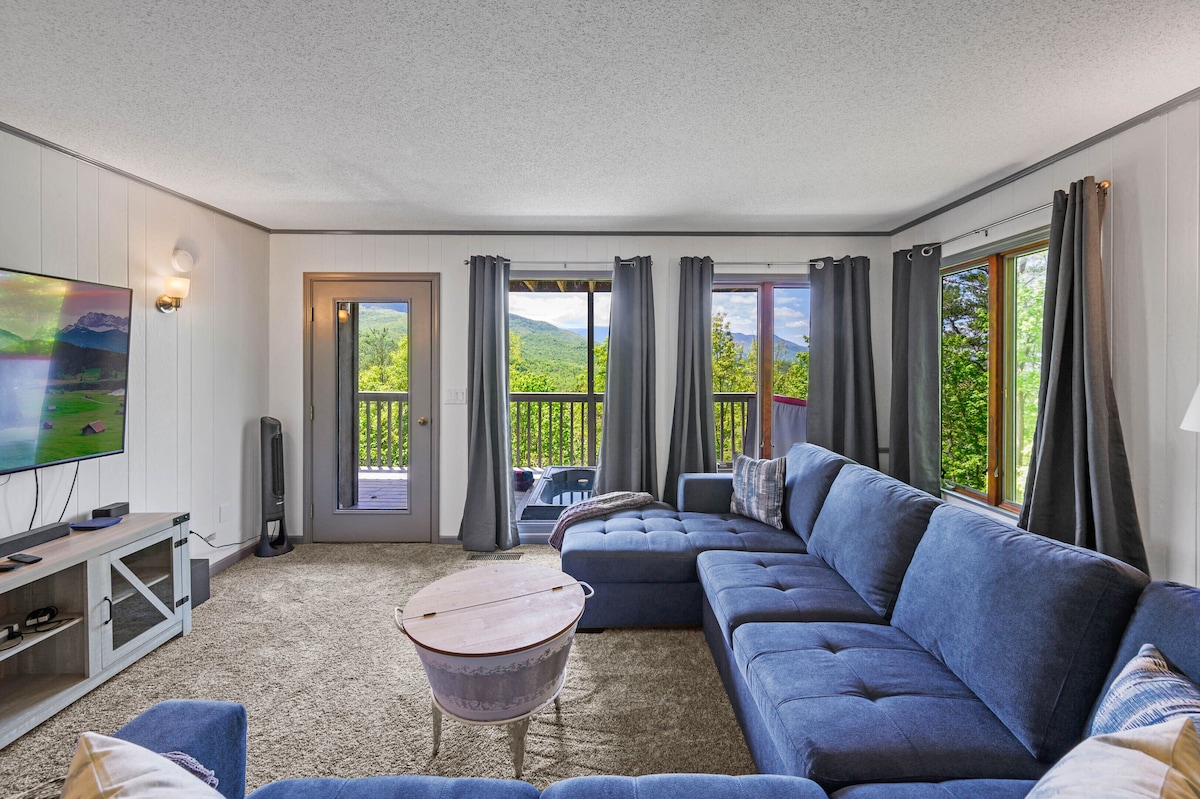 Enjoy family movie nights in this cozy room wit walk out to deck and hot tub