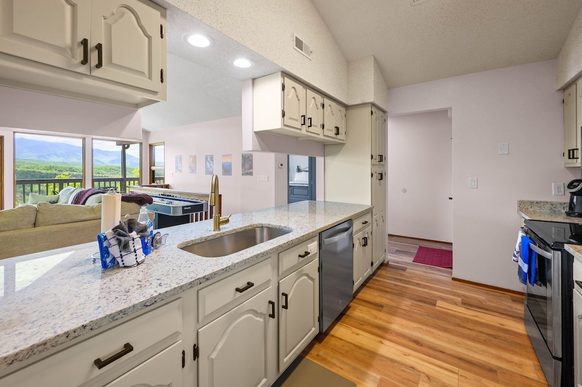 Kitchen with marble countertops and stainless farmhouse sink