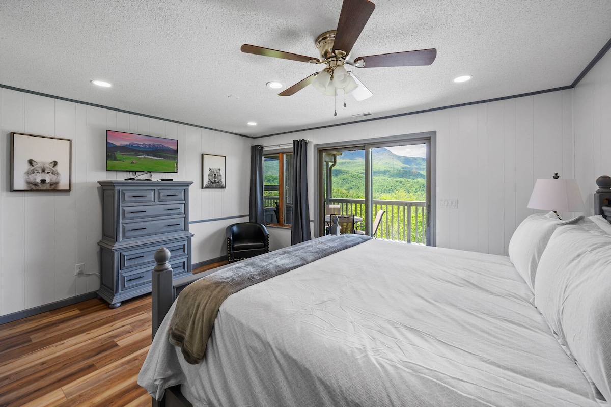 First floor master with sliding doors to the deck and connected full bath