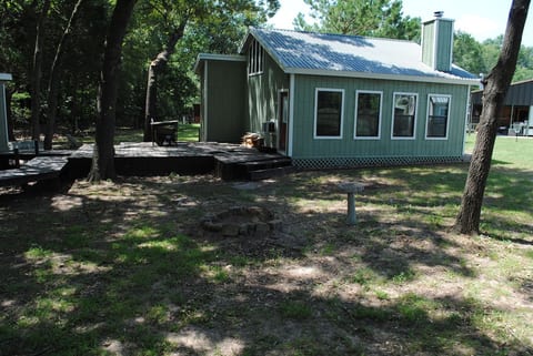 Decking behind the Bonham cabin that connects to other cabins (available to rent for larger groups).