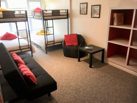 The upstairs "kids' domain": 2 bunk beds, 1 futon, 1 large smart TV, private bath, games
