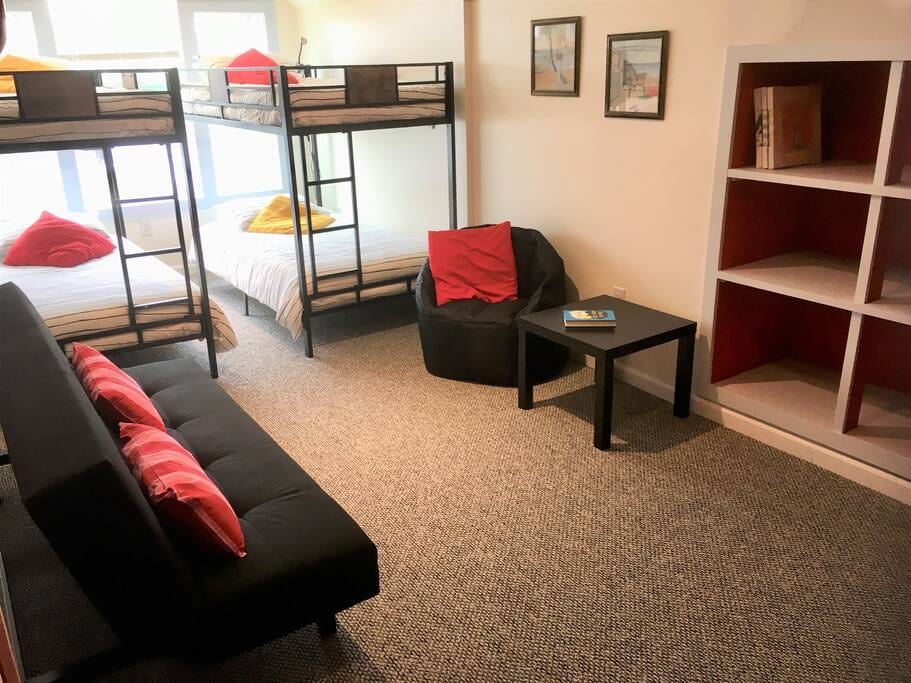 The upstairs "kids' domain": 2 bunk beds, 1 futon, 1 large smart TV, private bath, games