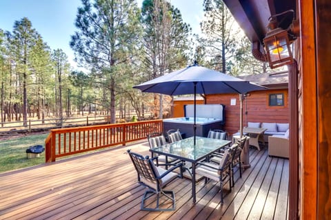 Spacious deck with seating and dining areas + hot tub