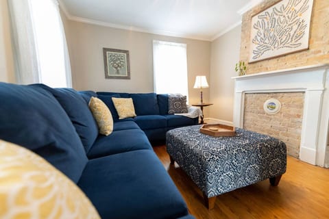 One of two living spaces, this room boasts a comfy, large sectional and smart Roku TV so you can log into your streaming apps (not pictured, but on the right of the brick).