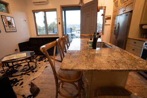 The open concept kitchen/living space offers bar seating for five, granite counter tops, ice maker, dishwasher and a double convection oven with air fry capabilities. Make a gourmet meal at your home away from home.