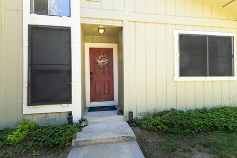 Welcoming front entry with a bold red door and easy walk-up access