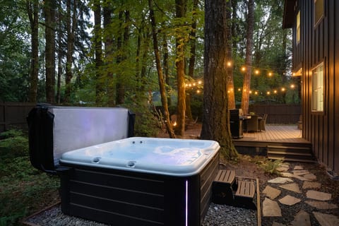 Steam rising, string lights glowing — the hot tub is calling your name.