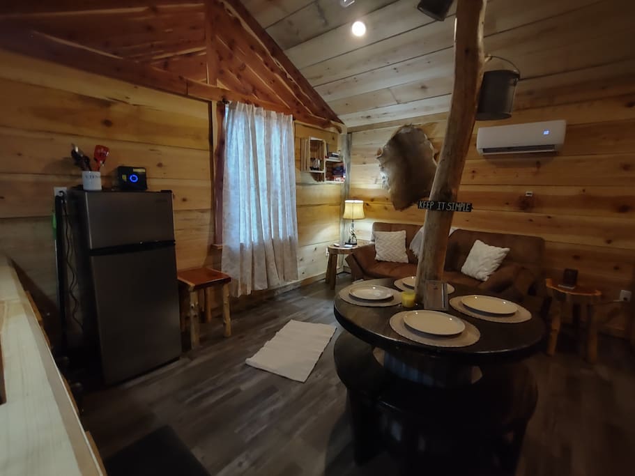 Kitchen, dining, and living room area.  Enjoy your morning breakfast at this beautiful rustic country table! - Lil' Rustic Retreat w/Hot Tub right on Jack Creek - Caddo Gap