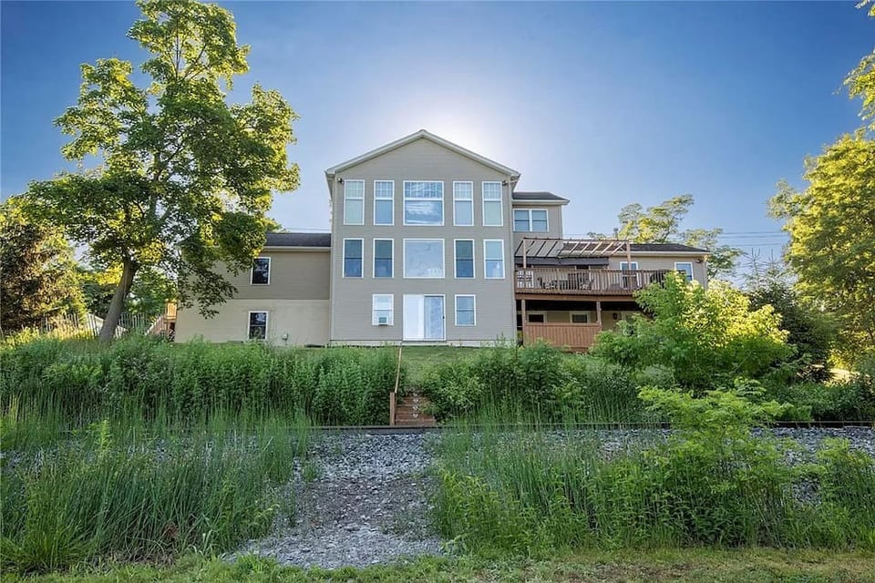 Full wall of windows to enjoy the beautiful Cayuga Lake view!