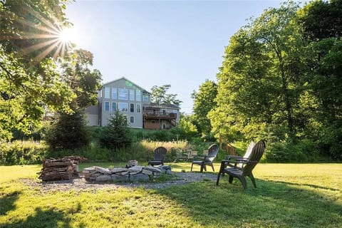 The backyard gives ample space for activities, has a fire pit for campfires, and is right next to Cayuga Lake!
