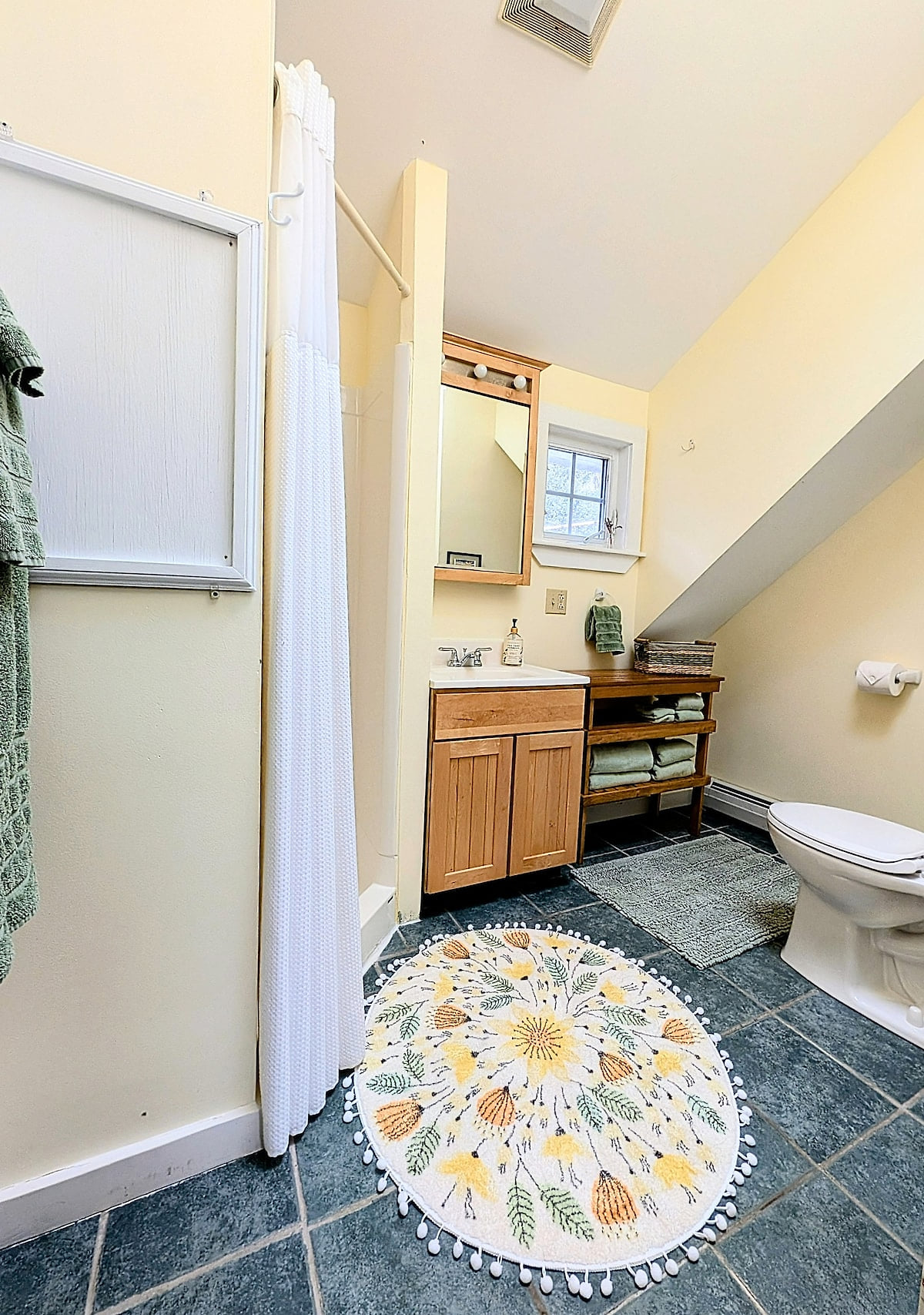 Bright, clean bathroom stocked with all the essentials—plus a little extra to make your stay more comfortable!