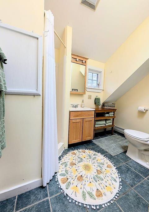 Bright, clean bathroom stocked with all the essentials—plus a little extra to make your stay more comfortable!