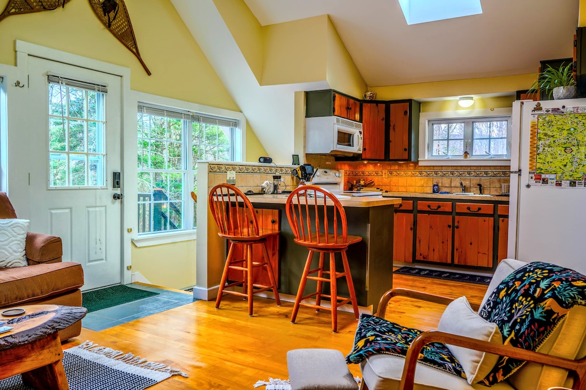 Counter with two barstools—perfect for enjoying meals, tackling remote work, or playing a board game with friends or family. Alpine Apartment Suite