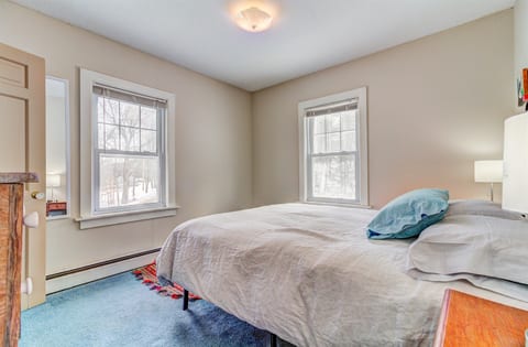 Queen bedroom with natural light