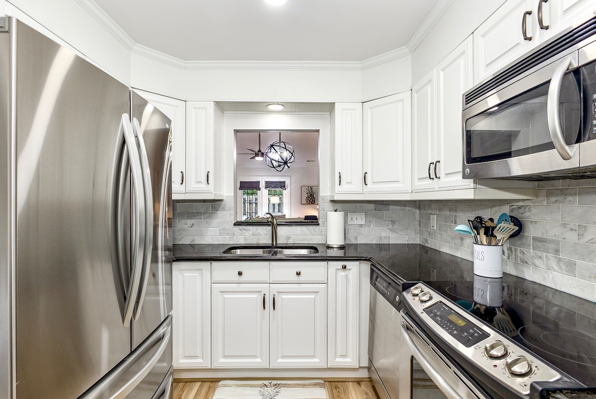 Well equipped kitchen with large fridge. 