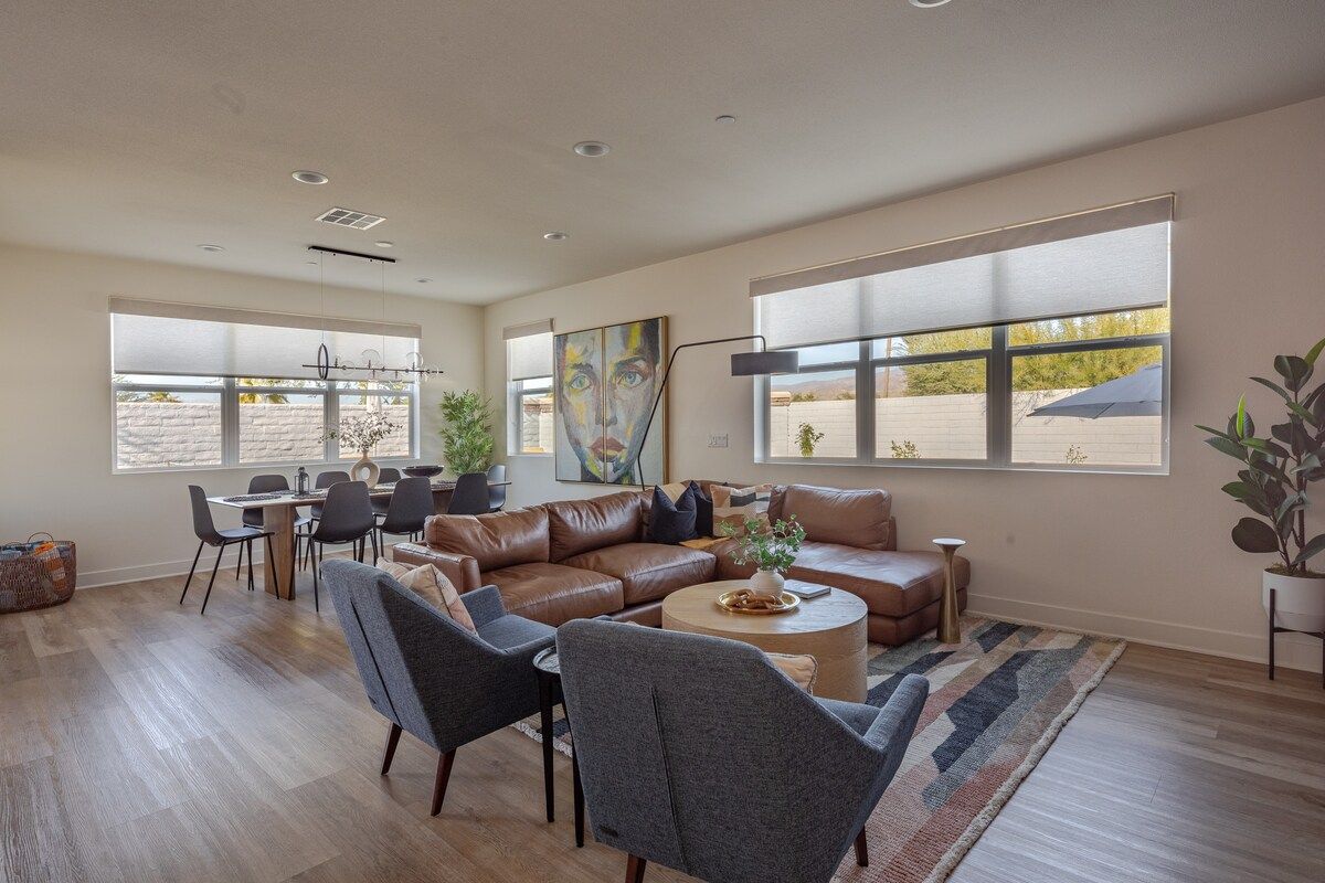Spacious, cozy, and stylish living room with comfortable seating, warm lighting, and a welcoming atmosphere—perfect for relaxing or gathering with friends and family